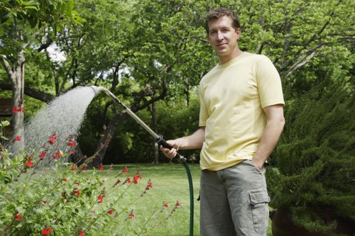 Seasonal hedge maintenance in a vibrant Enfield garden