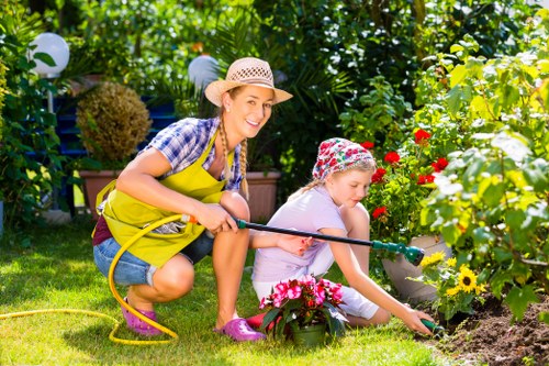 Gardeners Enfield performing scheduled maintenance on a suburban lawn